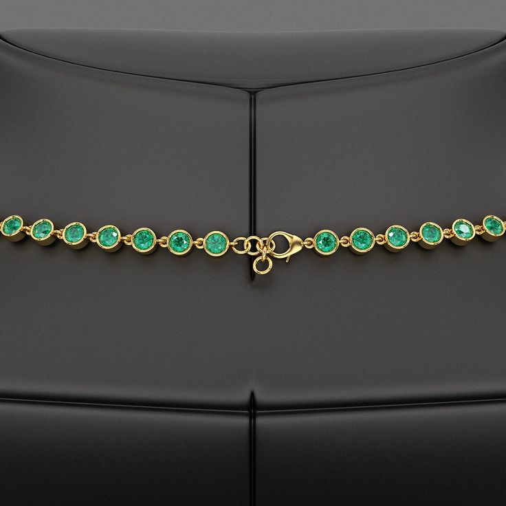 Adorn her with timeless elegance with our 9.36 Carat Natural Emerald Choker Necklace in 14K Gold. This bezel-set, round-cut art deco design showcases the vibrant May birthstone, making it a perfect customized birthday gift for her. Exuding luxury and sophistication, this stunning necklace is a refined statement piece crafted to celebrate life’s special moments. 𝐅𝐞𝐚𝐭𝐮𝐫𝐞𝐬:• 𝐌𝐚𝐝𝐞 𝐭𝐨 𝐎𝐫𝐝𝐞𝐫• 𝐌𝐞𝐭𝐚𝐥: 𝟏𝟎𝐊 𝐆𝐨𝐥𝐝 | 𝟏𝟒𝐊 𝐆𝐨𝐥𝐝 | 𝟏𝟖𝐊 𝐆𝐨𝐥𝐝 • 𝐁𝐚𝐧𝐝 𝐂𝐨𝐥𝐨𝐫𝐬: Ro Elegant Gold Emerald Necklace, Exquisite Diamond Necklace With Emerald, Exquisite Round Emerald Diamond Necklace, Luxury Hand Set Round Emerald Necklace, Luxury Hand-set Round Emerald Necklace, Luxury Diamond Necklace With May Birthstone, Elegant Hand-set Emerald Necklace In Yellow Gold, Formal Round Diamond Necklace With Gemstones, Elegant Yellow Gold Hand Set Emerald Necklace