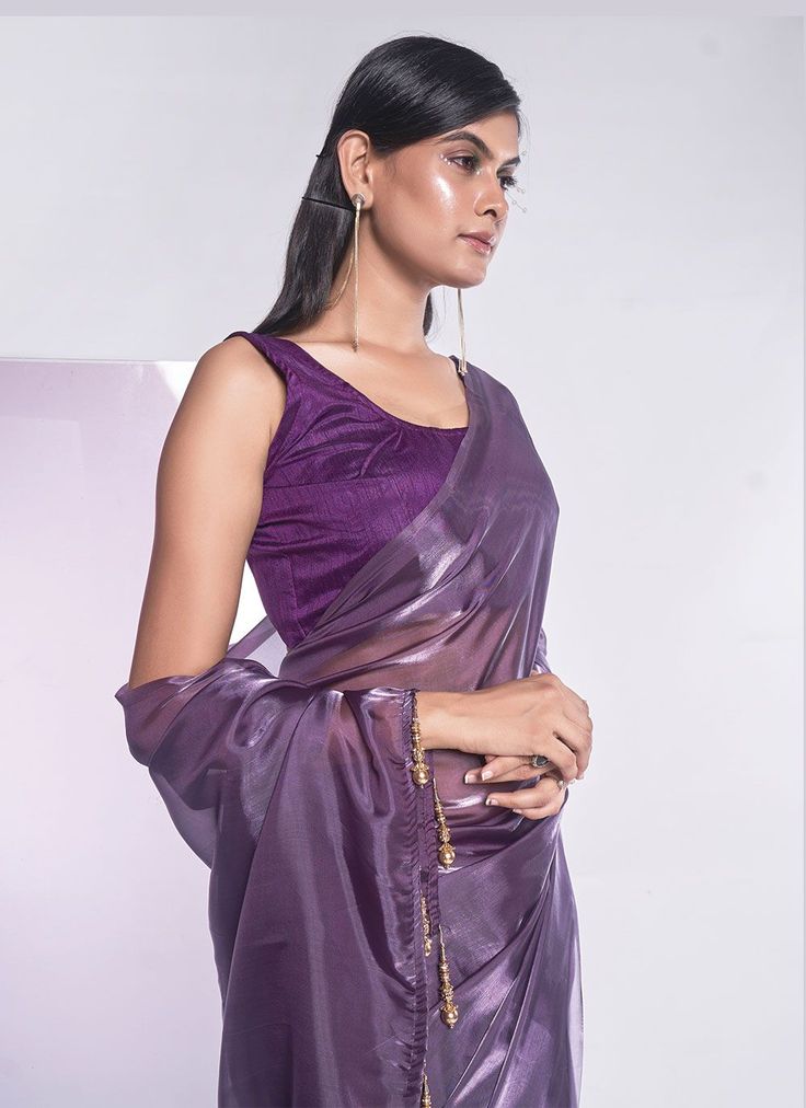 Product Features: Saree Color: Mauve Saree Fabric: Organza Blouse Color: Mauve Blouse Fabric: Art Silk Work: Solid Wash Care: Dry Clean Occasion: Festivewear, Partywear, Casual Product Type: Saree Disclaimer: There will be slight difference in digital to actual image Fitted Organza Blouse For Diwali, Party Purple Silk Pre-draped Saree, Festive Organza Blouse For Party, Sheer Blouse Piece For Party, Festive Party Tops With Sheer Dupatta, Organza Blouse For Celebrations, Elegant Sheer Blouse For Party, Fitted Party Top With Sheer Dupatta, Elegant Festive Sheer Blouse