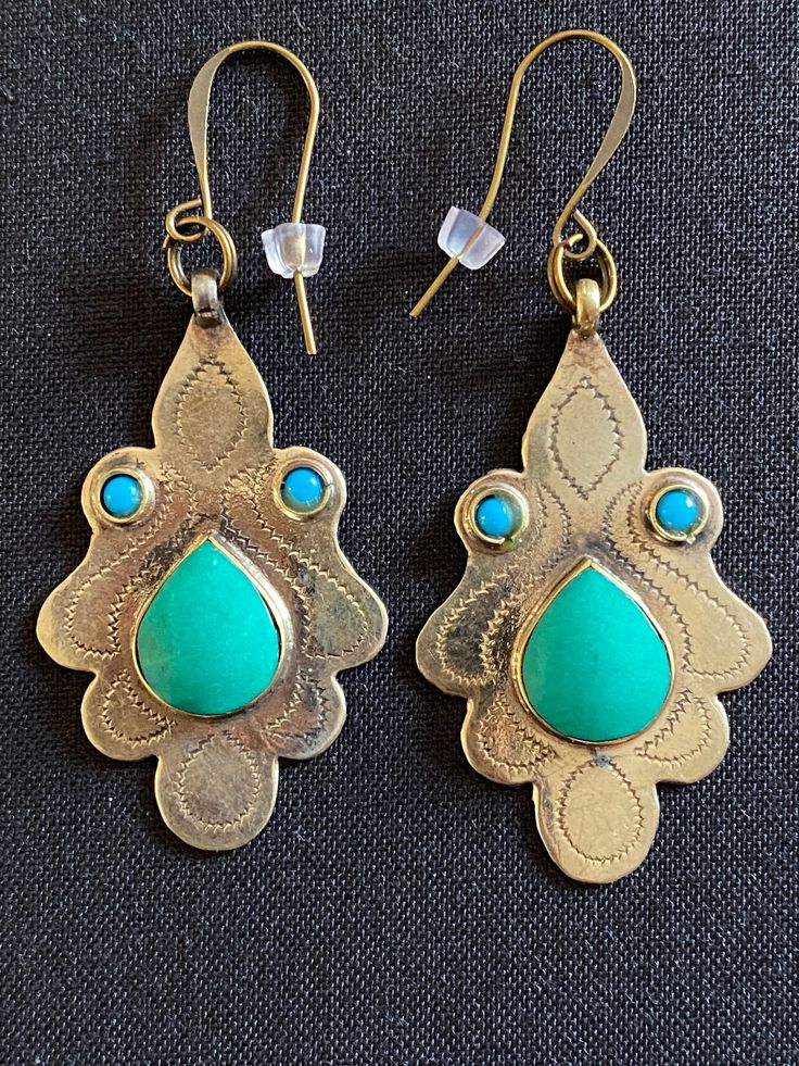 Chrysoprase and Turquoise bronze tribal ethnic chandelier belly dance bohemian earrings.   Beautiful and unique light bronze chandelier wire earrings with a cabochon chrysoprase tear shaped gemstone surrounded by two small round turquoise gemstones.  These earrings measure 2.5" in total length including the wire and 1" in width.  They are attractive and easy to wear.  They add lots of style and character to your attire and are sure to bring you lots of compliments. Bohemian Wire Wrapped Chandelier Earrings For Festivals, Bohemian Wire Wrapped Earrings For Festivals, Bronze Dangle Earrings For Festivals, Nickel Free Brass Chandelier Earrings For Festivals, Nickel-free Brass Chandelier Earrings For Festivals, Bohemian Bronze Earrings With Intricate Design, Bohemian Bronze Drop Earrings, Turquoise Brass Jewelry For Festivals, Turquoise Bohemian Brass Jewelry