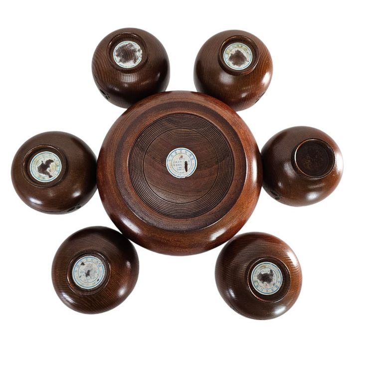 six wooden knobs with white buttons in the middle