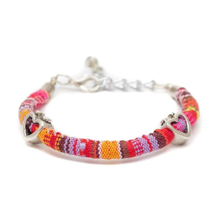 These fun, casual, and gorgeous bracelets are one of our best sellers and are perfect for adding some 'boho flair' to any outfit! Each piece features beautiful and colorful Guatemalan fabric wrapped around a bracelet that is detailed with silver beaded accents. Wear one or stack them - collect them all! As always... Handmade and Fair Trade! 7 1/2" L 100% Cotton Fabric Silver Beads and Clasp Colors/Patterns Will Vary Price is for one random Bohemian Fabric and Bead Bracelet WARNING: CHOKING HAZAR Multicolor Bohemian Bracelet For Spring, Multicolor Bohemian Beaded Bracelets With Silver Beads, Adjustable Beaded Bracelets For Spring Festival, Bohemian Bracelets For Spring, Bohemian Friendship Bracelets With Silver Beads, Bohemian Multicolor Bracelets With Silver Beads, Bohemian Multicolor Beaded Bracelets For Spring, Festival Multicolor Bracelets With Silver Beads, Multicolor Silver Beads Bracelets For Festival