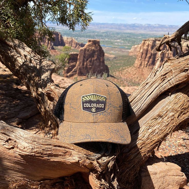 This unique Colorado-inspired hat features a screenprinted topo map on the front panels and visor, topped off with an ironed on Colorado Patch. Sweet Colorado patch features mountains and the Colorado Flag C. If you love hiking, biking or any other outdoors activities that involves elevation change (like most in Colorado) and trucker hats....then you definitely need this hat! Buy now and rep Colorado with style!! 50% cotton/50% polyester. Cotton front and trucker mesh back. Colorado patch ironed Snapback Hat For Outdoor Activities, Brown Trucker Hat For Outdoor Activities, Brown Six-panel Trucker Hat For Outdoor Activities, Adjustable Graphic Print Hat For Outdoor, Casual Graphic Print Trucker Hat For Outdoor, Casual Trucker Hat With Graphic Print For Outdoor, Graphic Print Snapback Hats For Outdoor, Outdoor Trucker Hat With Graphic Print And Curved Brim, Brown Trucker Hat For Hiking