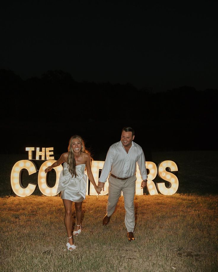 a man and woman standing in front of the words'the corrals '