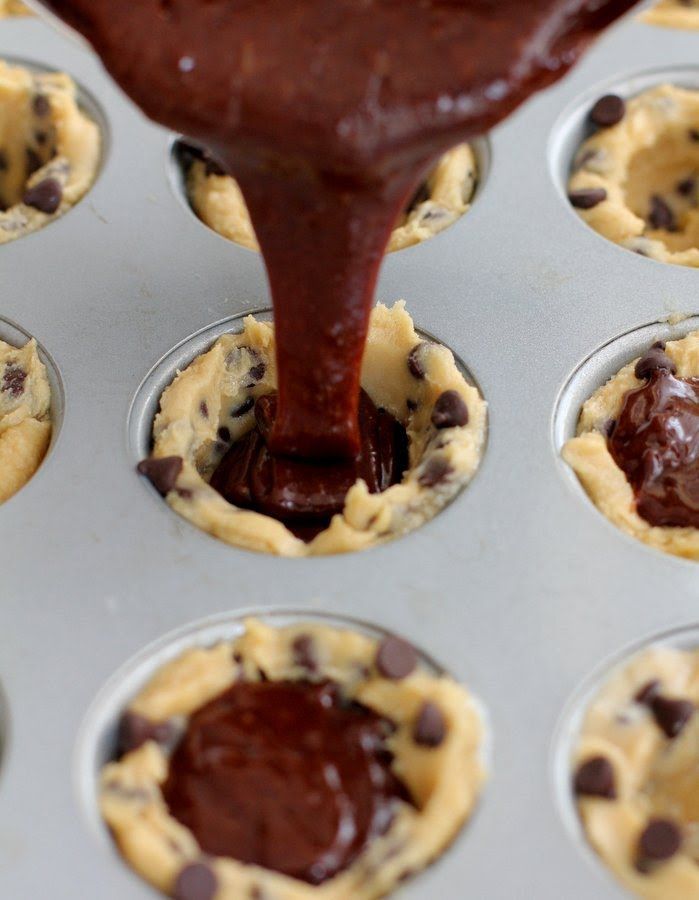 chocolate chip cookie cups being filled with batter