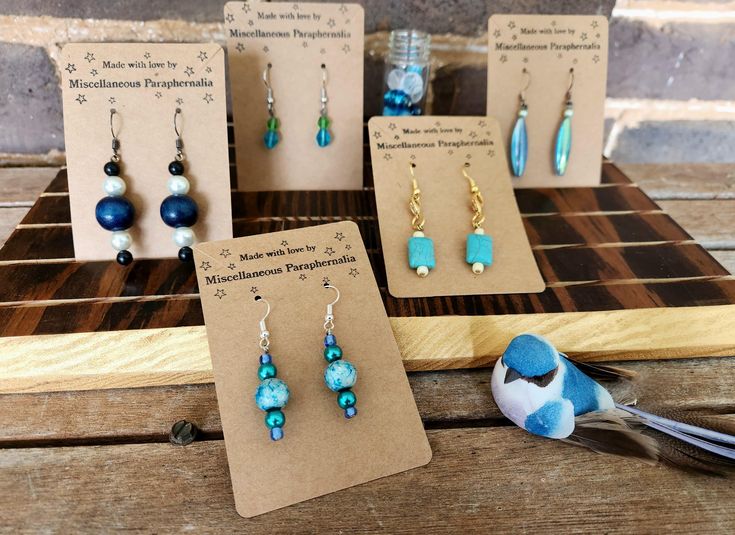 These stunning blue earrings are the perfect touch of ocean or sky. They are crafted from upcycled materials and are $10.00 each. Each pair is unique, so pick your favorite from the variation menu. Earring Collection, Upcycled Materials, Earrings Collection, Blue Earrings, Charleston, Jewelry Earrings Dangle, Dangle Drop Earrings, Dangle Earrings, Accessory Gift