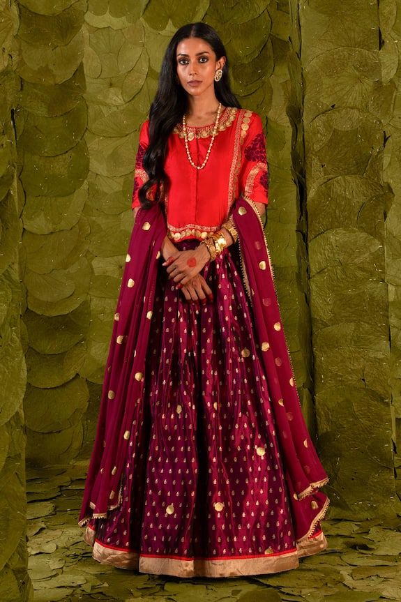 Plum maroon lehenga with silk tape, aari, zari and silk thread embroidery. Paired with an embroidered long blouse and a circular butti embroidered dupatta. - Aza Fashions Red Tissue Silk Dupatta For Wedding, Red Tissue Silk Anarkali Set For Eid, Red Raw Silk Set With Dupatta, Red Dola Silk Lehenga For Eid, Red Tissue Silk Sets With Sheer Dupatta, Red Anarkali Set In Tissue Silk, Unstitched Red Lehenga With Sheer Dupatta, Red Tissue Silk Salwar Kameez For Festivals, Unstitched Red Chandbali Choli