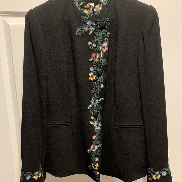 Beautiful Jacket With Embroidered Stand Up Collar, Embroidery Continues Down The Front And Repeats Around Cuff. Size 10. This One Is Special! New With Tags. Great For A Special Occasion. Measurements: Pit To Pit 18.5” Waist 17” Shoulder To Hem 26” Formal Blazer With Floral Embroidery And Long Sleeves, Formal Long Sleeve Blazer With Floral Embroidery, Elegant Long Sleeve Outerwear With Multicolor Embroidery, Winter Formal Blazer With Floral Embroidery, Elegant Multicolor Embroidered Long Sleeve Outerwear, Elegant Floral Embroidered Outerwear For Work, Elegant Multicolor Embroidered Outerwear, Elegant Winter Outerwear With Floral Embroidery, Elegant Floral Embroidered Winter Outerwear