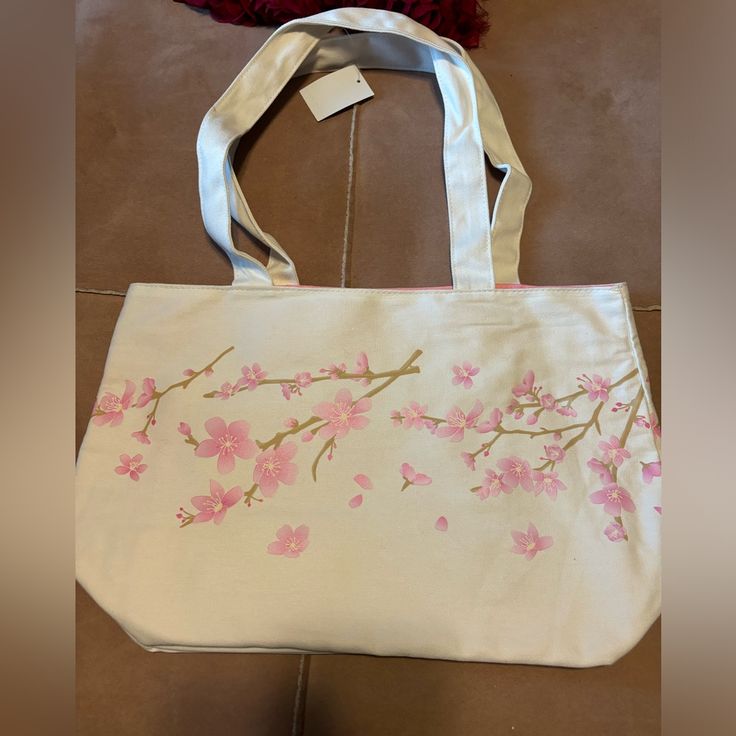 Nwt Tote Bag. Cherry Blossom Print. Inside Bag Is Lined In Pink With Zippered Pocket. Beautiful Bag Large Capacity Canvas Bag For Spring, Spring Travel Canvas Bag, White Canvas Bag For Spring, Spring Floral Print Canvas Bag, Spring Shopping Canvas Bag, Spring Canvas Shopping Bag, Spring Tote Shoulder Bag As Gift, Spring Tote Shoulder Bag For Gift, Spring Shopping Bags