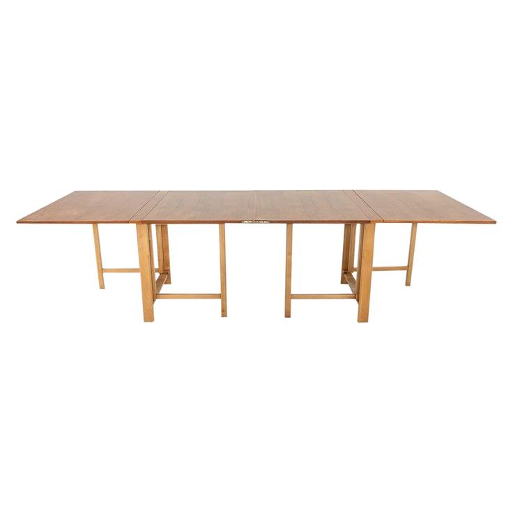 a wooden table with two legs and a long rectangular dining table in the middle, against a white background