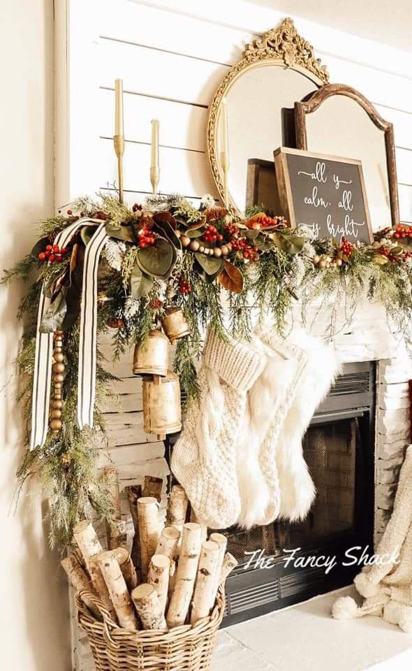 a fireplace mantel decorated with stockings, stockings and wreaths on top of it