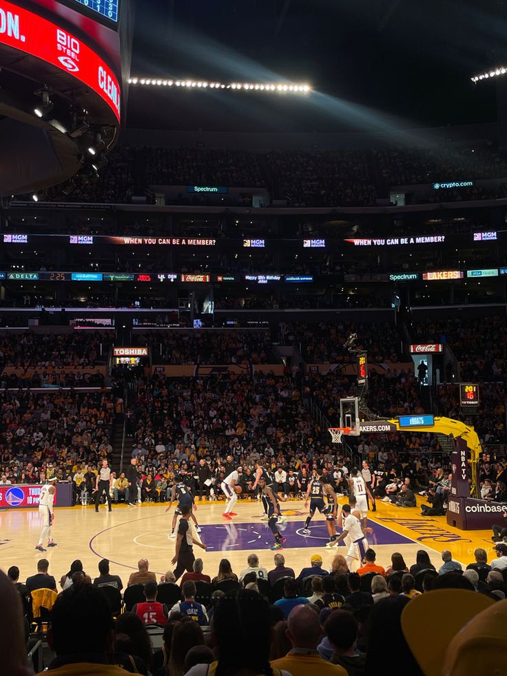 a basketball game is being played in an arena