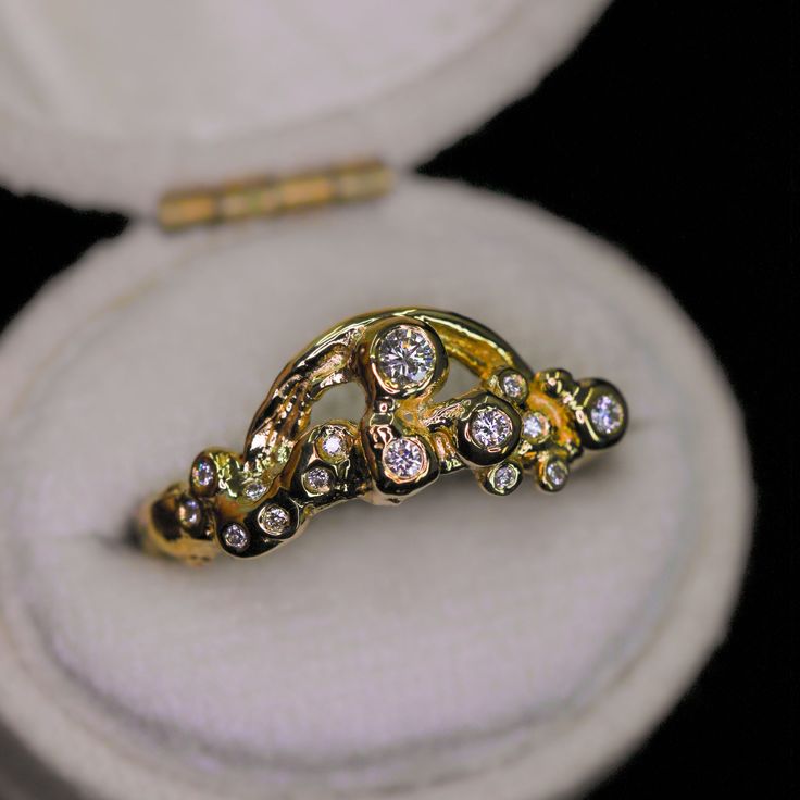 This sparkly ring design is our new Rainbow & Cloud ring (but the largest diamond represents the "sun") in 14K gold and encrusted with diamonds. This piece is imbued with sunshine and joy. A rainbow and sparkling diamonds are set into bubbly "clouds", an abstract representation of sunshine and joy after the rain. Nicole created this ring with different methods of ancient goldsmithing and fusing and then created a mold so that we can recreate this in different 14K gold colors. It is truly a spiri Luxury Yellow Gold Ring With White Topaz, White Gold Crystal Ring With Single Cut Diamonds, Yellow Gold Sterling Silver Wedding Rings With Diamond Accents, Fine Jewelry Diamond Crystal Ring With Single Cut Diamonds, Celestial Style Promise Ring With Rose Cut Diamonds, Fine Jewelry Crystal Ring With Diamond Accents, 14k Gold Cluster Ring With Rose Cut Diamonds, Promise Diamond Ring With Single Cut White Topaz, 14k White Gold Rose Cut Diamond Ring