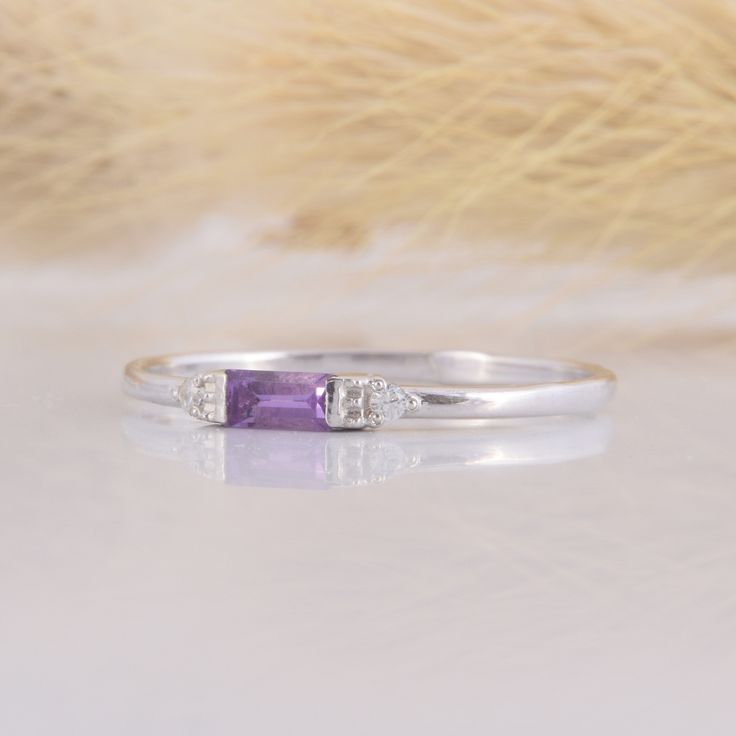 925 sterling silver small & delicate womens promise ring, Tiny petite silver amethyst promise ring for her,Baguette cut purple amethyst ring WE OFFER UNLIMITED PERIOD INSTALLMENTS PLAN This is a beautiful, stunning, feminine ring that works well for all occasions, styles, and ages. You will love it! Ring information: Main stone: Amethyst Approximate size: 4x2mm Accent stones: Cubic zirconia Approximate size: 1.5mm (2 stones) Metal type: Silver Metal stamp: 925 sterling silver Installment Pay Promise Ring For Her, Purple Amethyst Ring, Fancy Gifts, Amethyst Gem, Promise Rings For Her, Purple Band, Baguette Cut, Rings For Her, Amethyst Ring