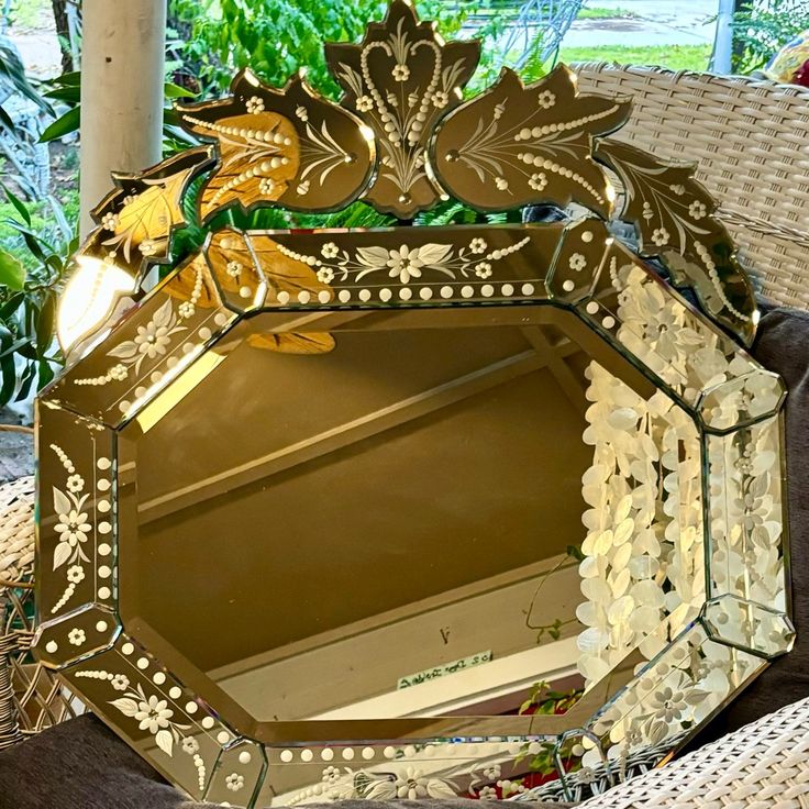 a mirror sitting on top of a wicker chair