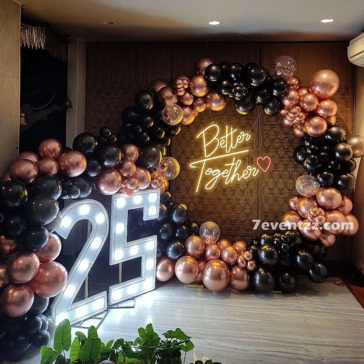 the entrance to an event decorated with balloons