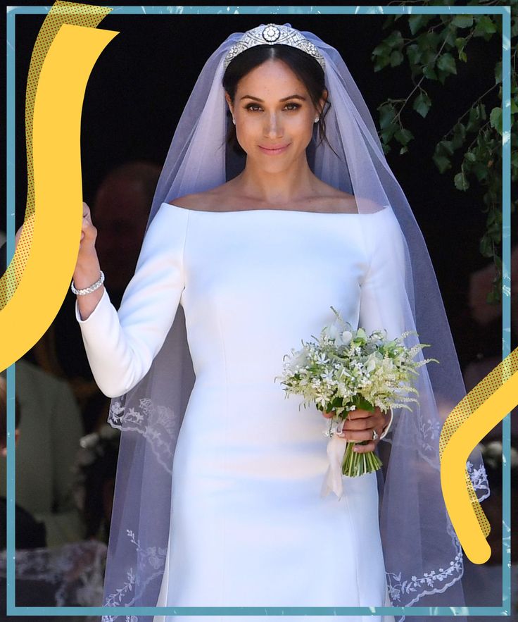 a woman in a white wedding dress holding a bouquet and wearing a tiara on her head