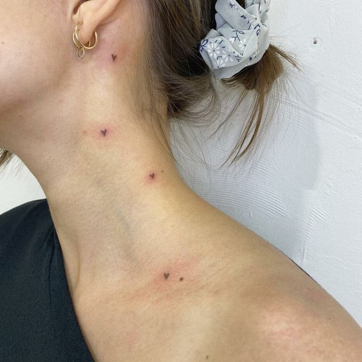 a woman with acne on her neck and behind her ear is a white wall