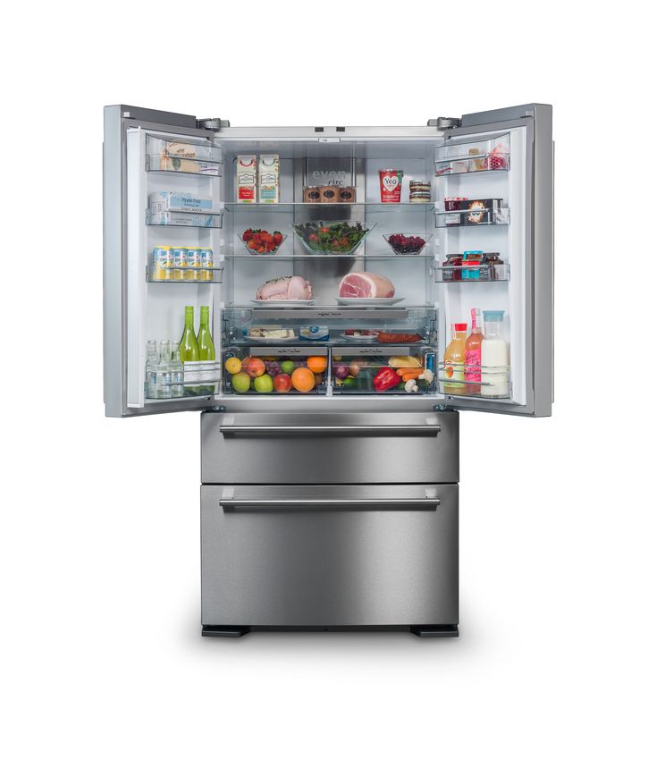 an open refrigerator with its doors wide open and full of food on the bottom shelf