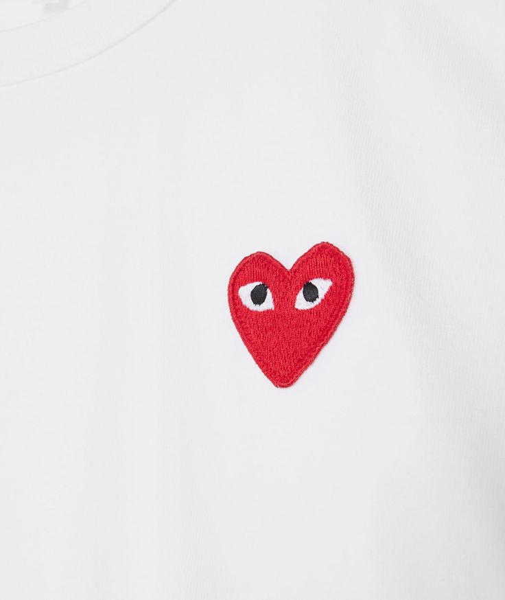 The Red Heart T-Shirt model   by  Comme des Garçons Play  which is part of the SU2021  season, has arrived || is now available at . Red Crew Neck T-shirt With Embroidered Logo, Casual Red T-shirt With Heart Graphic, Red Crew Neck Top With Logo, Red T-shirt With Embroidered Logo For Streetwear, Red Graphic Tee With Logo, Red Crew Neck Top With Embroidered Logo, Casual Red Tops With Logo, Red Short Sleeve Tops With Logo, Casual Crew Neck T-shirt With Heart Patch