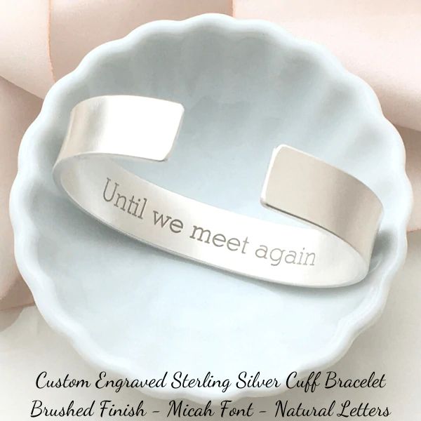 Personalize this handcrafted .925 solid sterling silver custom engraved cuff bracelet with your favorite quote, scripture verse, or encouraging message for a one-of-a-kind, keepsake. Whether given as a gift or created to serve as a "note to self", your heartfelt inscription is sure to bring a smile. Ignite your creativ Adjustable Sterling Silver Bracelet For Anniversary, Sterling Silver Hand-stamped Bracelet, Anniversary Engraved Sterling Silver Name Bracelet, Hand Stamped Silver Bangle, Hand Stamped Silver Bangle Bracelets, Silver Hand Stamped Bangle Bracelets, Inspirational Engraved Text Bracelets For Gifts, Silver Hand Stamped Bangle Jewelry, Adjustable Hand Stamped Sterling Silver Bracelet