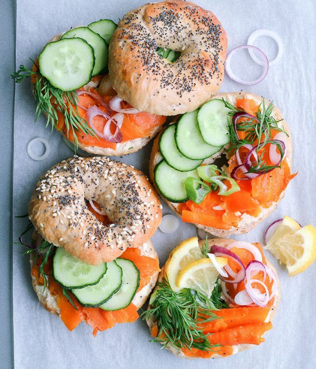 bagel sandwiches with salmon, cucumbers and onions