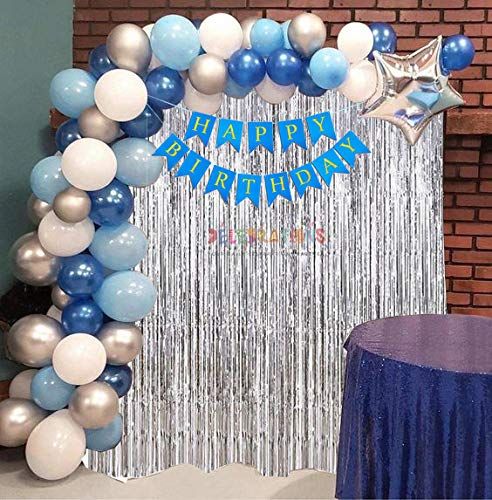 a blue and white balloon arch with the words happy birthday on it