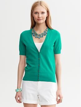 Short-Sleeve Cardigan V-neck Cardigan With Button Cuffs For Work, Classic V-neck Cardigan With Button Cuffs, Chic Spring V-neck Sweater For Workwear, Trendy V-neck Sweater For Spring Workwear, Classic V-neck Sweater For Spring Layering, Elegant Cotton V-neck Cardigan, Fitted V-neck Sweater For Spring Layering, Green V-neck Top With Ribbed Cuffs, Green Spring Cardigan With Ribbed Cuffs