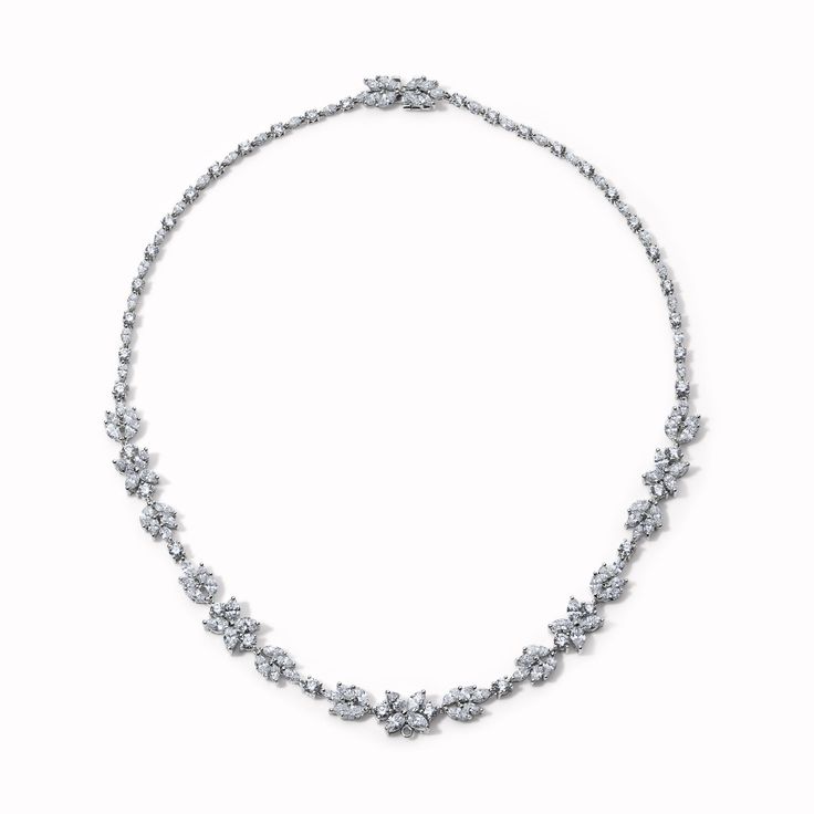 This special modern estate necklace was designed with a floral motif comprised of marquise diamonds and full cut round diamonds. Available in Platinum Diamond weight = 17.5 carats Diamond quality = G/H color, VS/VS2 clarity Necklace length = 16.25in Clasp is a diamond flower Center flower features an enhancer bail and can be used to add a charm. This can be removed upon request. Estimated from the 1990s Vintage and Antique jewelry should be handled and worn with extra care. This item is FINAL SA Exquisite Silver Marquise Necklace, Marquise Diamond Necklace With 17 Jewels, Formal Bridal Marquise Diamond Necklace, Exquisite Marquise Diamond Necklace, Classic Marquise Necklace For Wedding, Luxury Marquise Diamond Necklace For Wedding, Dazzling Marquise Diamond Necklace For Wedding, Silver Marquise Diamond Bridal Necklace, Diamond White Marquise Diamond Necklace For Formal Occasions