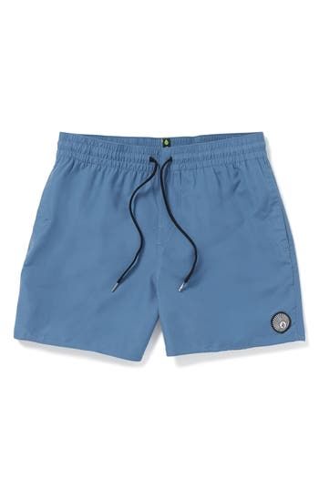 Head straight to the beach in these stretchy, quick-drying swim trunks that take you from water to land and back in comfort. 5 1/2" inseam; 22" leg opening; 11" front rise; 14 1/2" back rise (size Medium) Elastic/drawstring waist Side-seam pockets; back flap-patch pocket with drainage grommets Machine wash, tumble dry Imported Blue Nylon Athletic Shorts For Beach, Casual Swim Trunks For Warm Weather Swimming, Casual Stretch Swim Trunks For Beach, Casual Swim Trunks For Swimming, Casual Swim Trunks For Warm Weather, Beach Shorts With 4-way Stretch, Beach 4-way Stretch Shorts, Summer Beach Lightweight Athletic Shorts, Casual Nylon Swim Trunks For Poolside