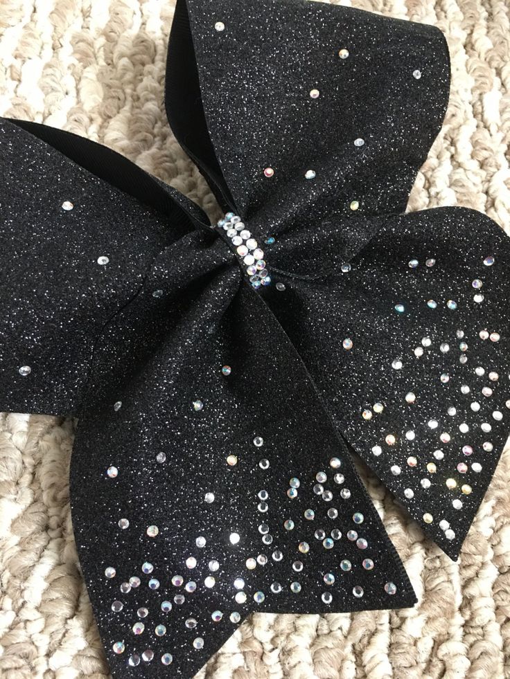 "All of our bows are hand crafted by RouzandLezar.  Black  cheer bow in biggest size 3\" wide ribbon and White grosgrain ribbon. Black glitter vinyl ribbon . Silver and multicolor rhinestones Bow measures are approx. 8\" accross and 7.5\" in lenght. You can choose from other rhiestones color or base color ribbon.  These are competition quality bows and can be customized to team colors- even half and half. We offer discounts and group shipping for team and large orders. Contact us for pricing and Cheer Bows Diy, Cute Cheer Bows, Competition Cheer, Competition Bows, Cheer Hair Bows, Glitter Cheer Bow, Cheerleading Bows, Cheer Hair, Competitive Cheer