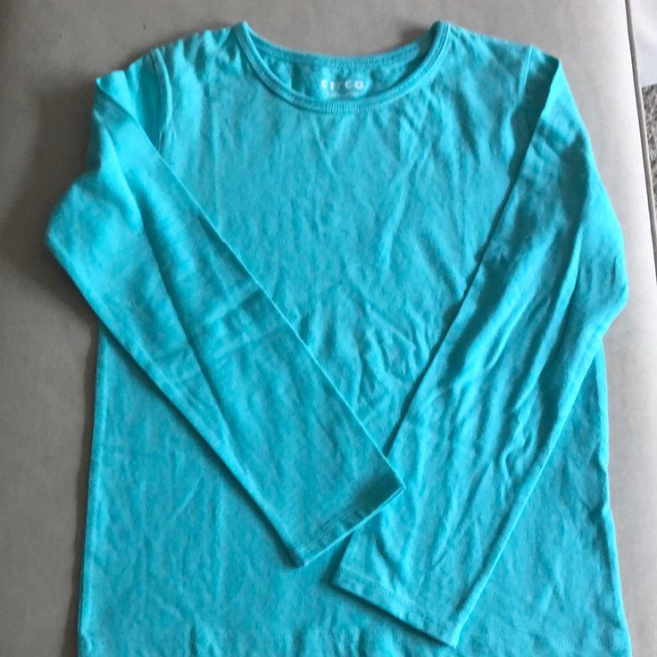 Long Sleeves Aqua Blue Plain Long Sleeves Tee. No Label But Was Never Worn In 100% Cotton. Plain Blue T-shirt For Spring, Basic Blue Long Sleeve T-shirt, Blue Long Sleeve Basic T-shirt, Blue Cotton Long Sleeve T-shirt, Blue Long Sleeve Cotton T-shirt, Turquoise Cotton Crew Neck T-shirt, Casual Turquoise Crew Neck T-shirt, Basic Blue Spring Shirt, Basic Light Blue Plain Top