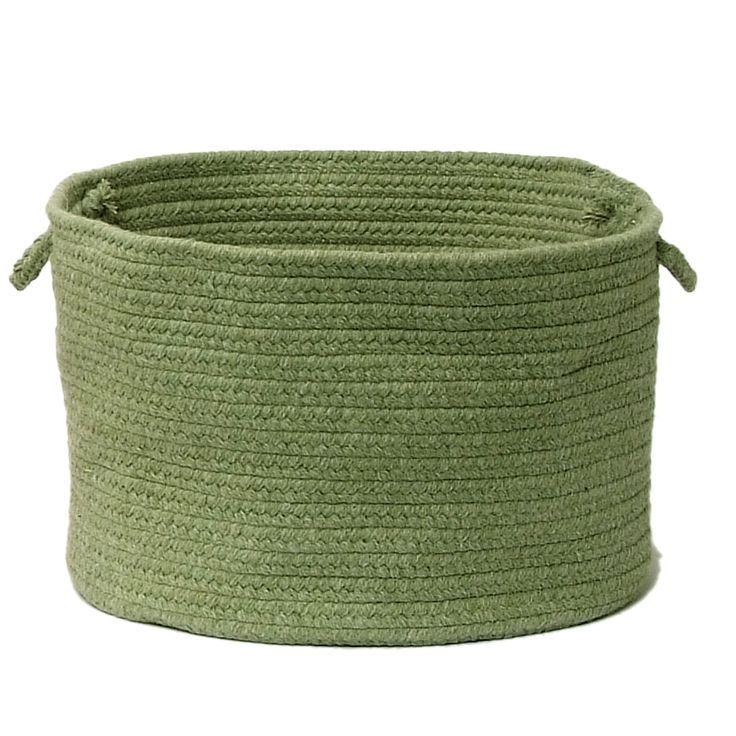 a large green rope basket with handles on the top and bottom, sitting in front of a white background