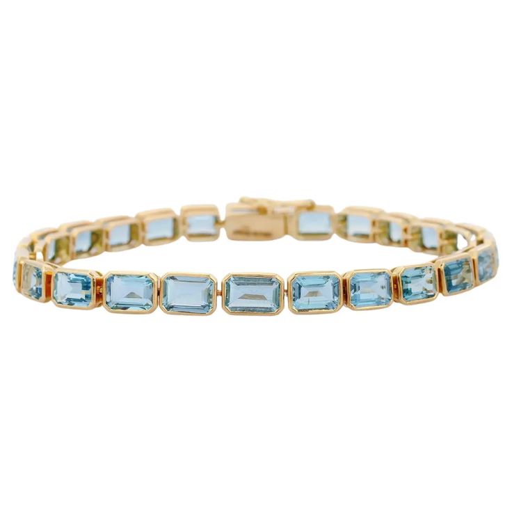 For Sale on 1stDibs - Aquamarine bracelet in 18K Gold. It has a perfect octagon cut gemstone to make you stand out on any occasion or an event. A tennis bracelet is an essential Luxury Yellow Gold Emerald Cut Bracelet, Yellow Gold Emerald Cut Tennis Bracelet For Formal Occasions, Emerald Cut Yellow Gold Tennis Bracelet For Formal Events, Emerald Cut Yellow Gold Tennis Bracelet For Formal Occasions, Classic Emerald Cut Gemstone Bracelets, Formal Yellow Gold Emerald Cut Tennis Bracelet, Formal Rectangular Bracelet In Fine Jewelry Style, Rectangular Bracelet For Formal Occasions, Fine Jewelry, Fine Jewelry Rectangular Bracelet For Formal Occasions