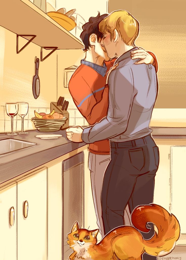 two people are hugging in the kitchen next to a cat and a bowl of food