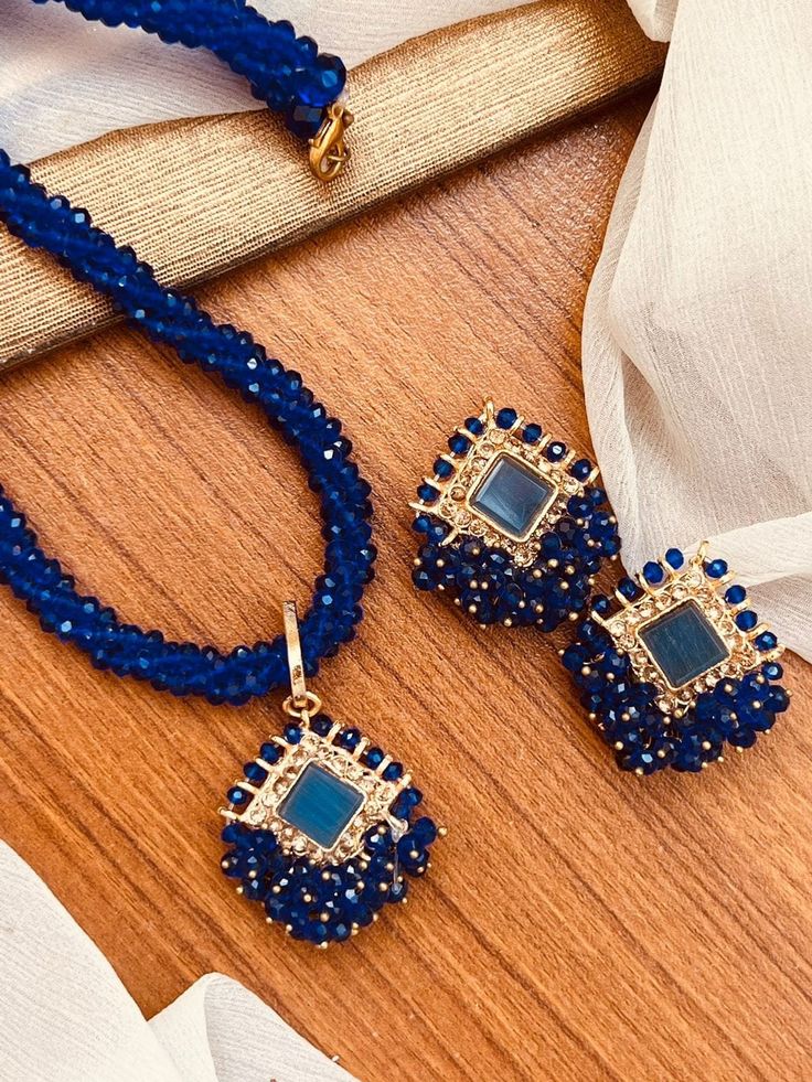 This stunning Gajra Mala Pendant Set with Earrings is a beautiful addition to any bridal or partywear outfit. The intricate design features multiple natural gemstones, and is crafted with excellent cut grade. It is ethically made in India and Pakistan, and boasts a traditional Asian style. Perfect for engagements, weddings, anniversaries, birthdays, and Valentine's Day, this Indian/Pakistani Bridalwear Partywear Jewellery is sure to impress. The set includes a beautiful pendant and matching earr Elegant Sets With Latkans For Celebration, Elegant Celebration Sets With Latkans, Festive Fusion Jewelry Sets, Fusion Style Diwali Jewelry Sets, Party Jewelry With Zari Work For Festivals, Festive Fusion Style Jewelry Sets For Celebration, Festive Fusion Jewelry Sets For Celebration, Elegant Party Danglers With Cutdana, Eid Celebration Jewelry Sets With Latkans