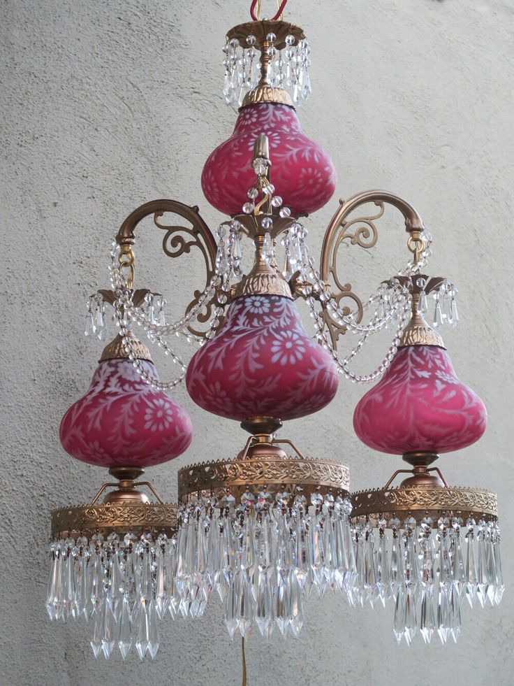 a pink chandelier hanging from the ceiling