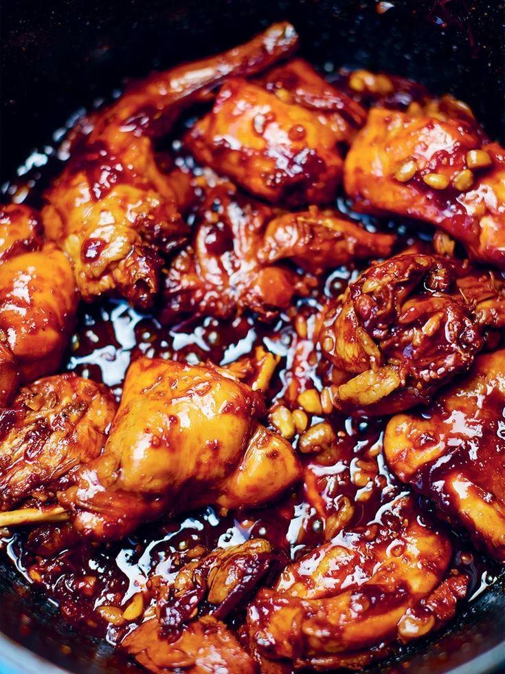 chicken with sauce and chopsticks in a pan