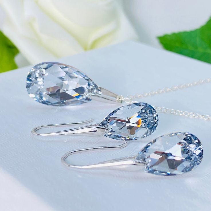 Elevate your style with our stunning set of silver jewellery featuring Comet Argent Light Crystals. This exquisite set includes a pair of earrings with a 32-millimetre drop and a necklace measuring 45 centimetres in length. Each piece is meticulously crafted from high-quality sterling silver, and adorned with mesmerizing Comet Argent Light Crystals that radiate a dazzling sparkle. The earrings and necklace are designed to catch the light from every angle, adding a touch of glamour to any outfit. Whether you're dressing up for a special occasion or looking for everyday elegance, this set is perfect for adding a touch of sophistication to your style. The unique design and shimmering crystals make this set a statement piece in your jewellery collection. Indulge in the beauty and sparkle of ou Earrings Necklace Set, Present For Her, Light Crystal, Crystal Jewelry Sets, Set Earrings, Crystal Jewellery, Silver Lights, Presents For Her, Jewellery Set