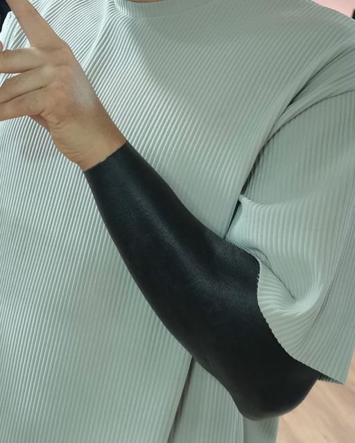 a woman with an arm cast holding a cell phone