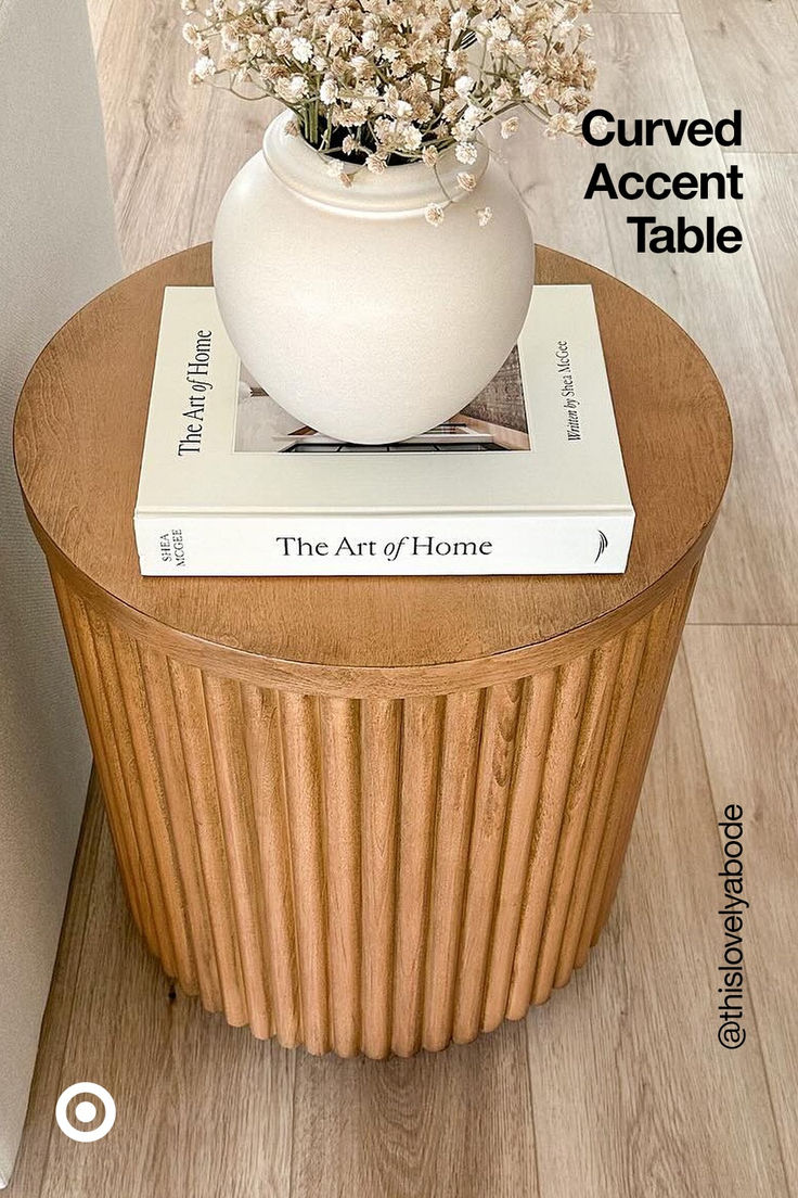 there is a vase with flowers on top of the table