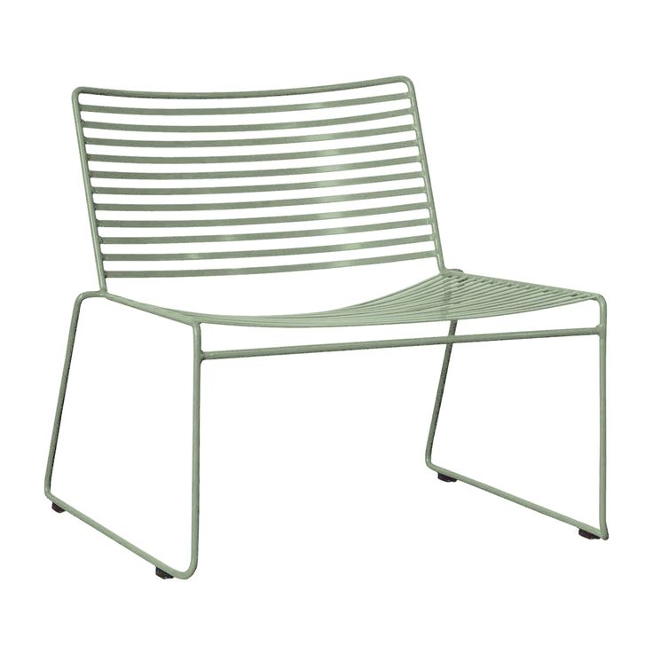 a green chair sitting on top of a metal frame