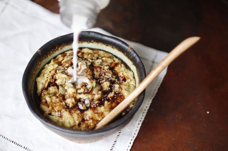 an oatmeal is being poured into a bowl