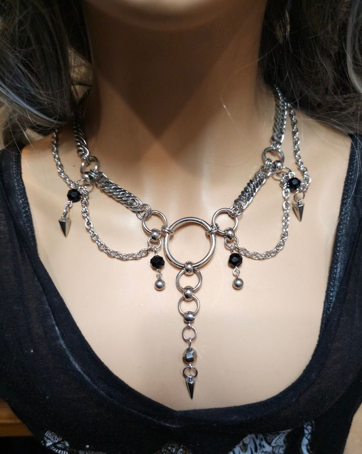 Handmade Stainless Steel Chunky Chain Gothic Edwardian style Choker Layered Necklace Set, a stunning piece of alternative punk fashion that will elevate any outfit with its bold and edgy look. This necklace features  strands of different chain styles and spikes, and it can be worn at various lengths due to the built-in extender. It runs from approximately 15 inches to 18 inches. it is all stainless steel so it is completely waterproof and will NEVER tarnish. The layered design of this necklace s Edgy Handmade Necklaces For Party, Punk Necklace With Lobster Clasp For Halloween, Punk Style Necklaces For Festivals, Edgy Metal Choker For Cosplay, Punk Style Clavicle Chain Necklace For Halloween, Punk Style Clavicle Chain Necklaces For Halloween, Alternative Metal Choker For Cosplay, Handmade Punk-style Choker Jewelry, Punk Style Handmade Choker Jewelry