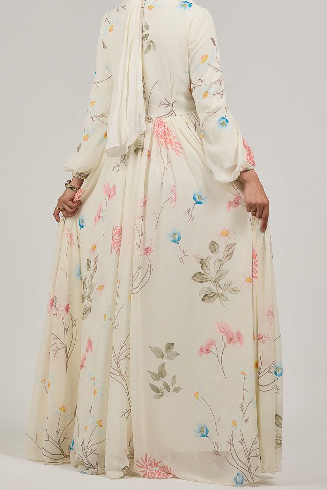 Step into a world of elegance with our Enchanting Blossom Chiffon Maxi Dress. This dress is adorned with a delicate floral print that adds a touch of grace and femininity. The long sleeves and flowing silhouette offer modest coverage, making it perfect for any occasion. Crafted from luxurious chiffon and lined with polymix fabric, this maxi dress ensures comfort and style. The subtle floral design in soft hues of pink, blue, and green creates a harmonious blend, enhancing the dress's ethereal be Maxi Dress With Long Sleeves, Modest Activewear, Full Coverage Swimsuit, Abaya Dress, Dress With Long Sleeves, Chiffon Maxi, Chiffon Maxi Dress, Active Wear Tops, Trousers Women