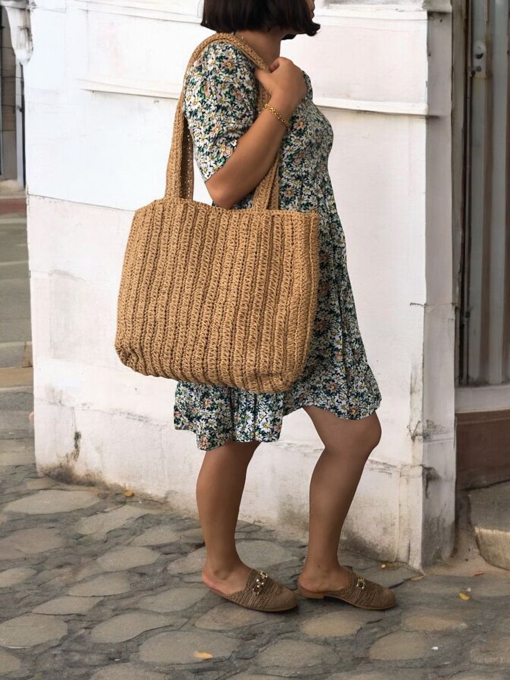 Any woman must have this bag for every fashionista. Whether you keeping it to yourself or gifting someone you care, it will be unforgettable. ✔️I made this beautiful bag from natural paper rope which is organic cotton and vegan leather in tan. ✔️You can choose the natural raffia strap or vegan leather strap option. Width: 45 cm Height: 35 cm Depth: 10 cm Color: Camel Lining: no ✔️The interior of the straw summer bag has a magnetic button. Suitable for use as handbag, market bag, beach bag or par Casual Everyday Bags Made Of Natural Fiber, Casual Natural Color Bag With Natural Fiber, Casual Natural Fiber Bags In Natural Color, Casual Natural Fiber Bag In Natural Color, Casual Natural Color Natural Fiber Bag, Woven Jute Shoulder Bag, Beachy Natural Color Shoulder Bag For Everyday, Casual Natural Fiber Shoulder Bag, Trendy Jute Shoulder Bag For Daily Use