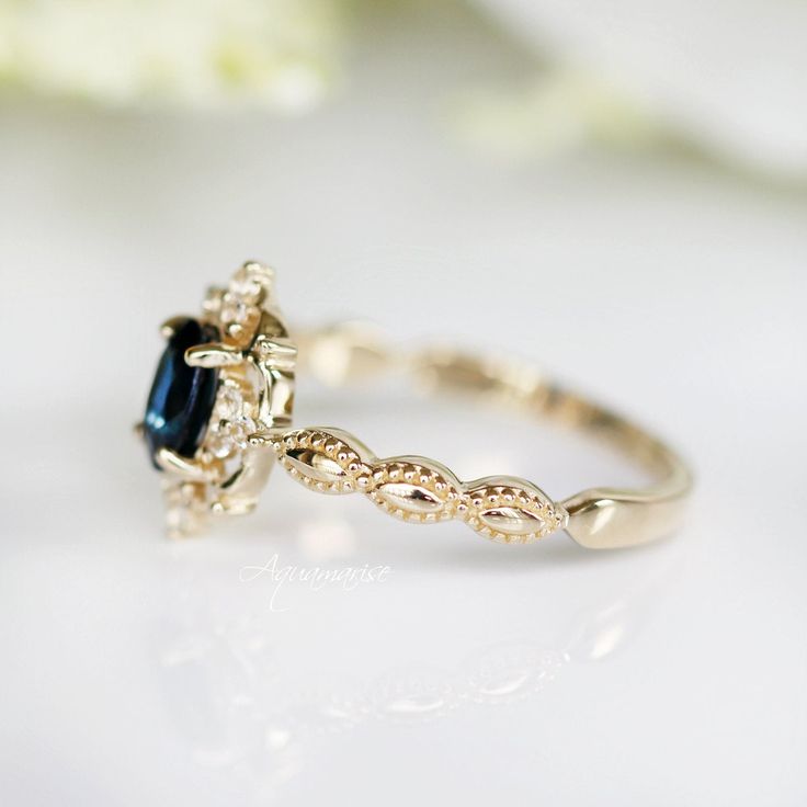 Gorgeous Vintage Inspired Sapphire Ring ►Available in solid gold with a gold purity of your choice: 10K/ 14K/ 18k (select option from a drop-down menu) ►Accented with natural diamonds, simulated diamonds, or moissanites of your choice (select option from the drop-down menu). Center Stone: Sapphire Stone Cut: Oval Color: Blue Gem size: 6.0 x 4.0 mm Carat Weight: 0.43 ct. Stone Creation: 100% Genuine Lab-Grown Sapphire Hardness: 9 (Mohs scale) ►Side stones information: #Natural diamond gemstone op Classic Cluster Ring With Halo Design For Wedding, Timeless Emerald-cut Birthstone Ring For Weddings, Timeless Emerald Cut Birthstone Wedding Ring, Timeless Promise Ring With Classic Design, Classic Halo Design Cluster Ring For Wedding, Heirloom Sapphire Ring With Halo Design For Anniversary, Classic Wedding Cluster Ring With Halo Design, Heirloom Birthstone Ring With Halo Setting, Heirloom Sapphire Ring With Halo Design