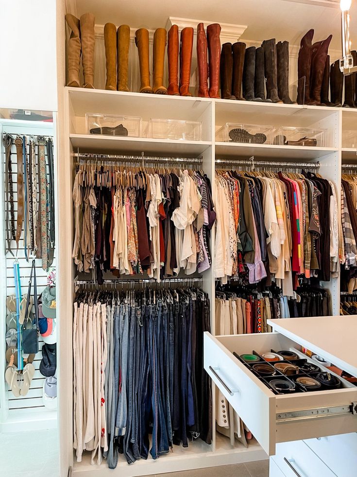 a closet filled with lots of clothes and shoes