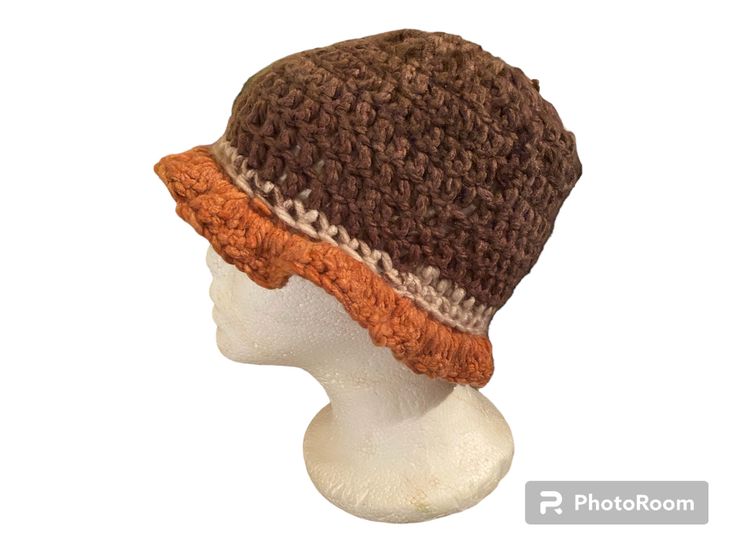 a crocheted hat on top of a mannequin head