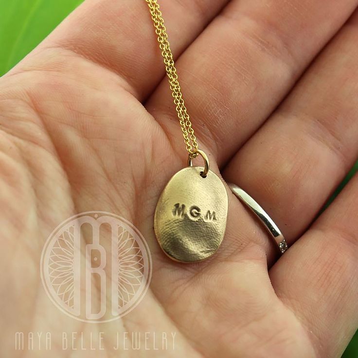 "One child's fingerprint in solid silver or solid bronze. The silver is paired with a sterling silver adjustable chain and the bronze with a 14k gf adjustable chain. This listing is for one child's fingerprint that is taken from a mold and fired as a solid, bronze or solid silver charm to cherish forever. If you would like an adult print or a child's thumb print rather than a child's finger print, send me a message and I'd be happy to create a custom listing for you, as they require more metal. Adjustable Hand Stamped Jewelry For Anniversary, Hand Stamped Adjustable Jewelry For Anniversary, Engraved Oval Pendant Jewelry For Everyday, Adjustable Sterling Silver Jewelry Stamped 14k, Personalized Oval 14k Gold Jewelry, Adjustable Hand Stamped Initial Pendant Jewelry, Adjustable Hand Stamped Sterling Silver Jewelry, Personalized Oval Jewelry For Everyday Use, Hand Stamped Sterling Silver Necklaces In Yellow Gold