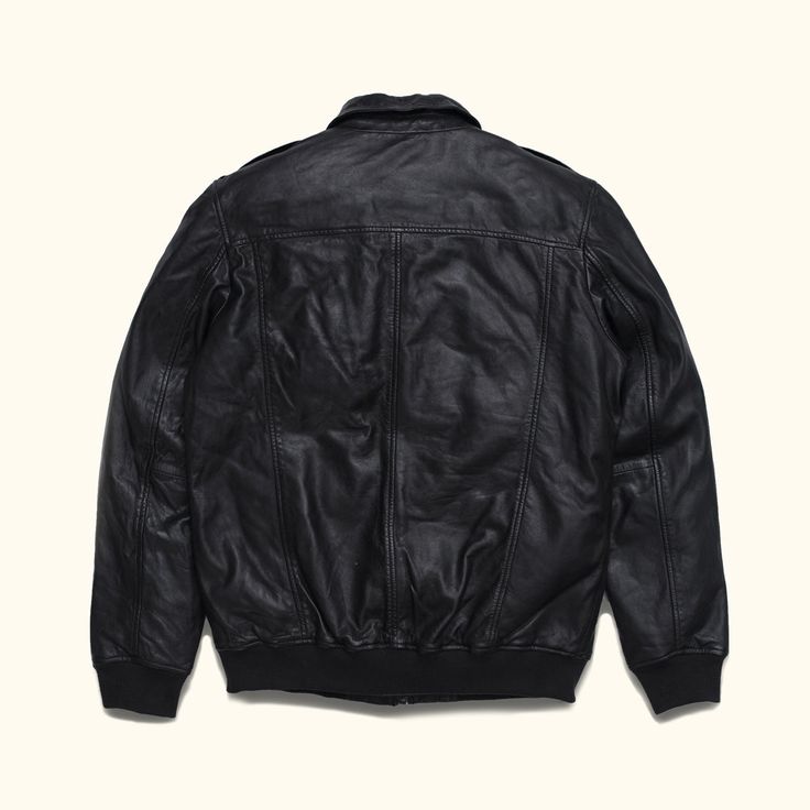 Introducing our Black Vintage Bomber Jacket – a timeless piece that transcends rugged elegance and the classic aviation charm. Crafted with 100% genuine lambskin leather - it has a soft and broken in feel to it that looks like its been handled with generations of care. Our black leather bomber jacket features a full zip up closure, color matched ribbed cuffs and waist, and a unique detachable sherpa collar that can be removed, or worn, to provide extra warmth and comfort for brisk nights on the Rugged Winter Leather Jacket For Work, Rugged Leather Jacket For Winter Workwear, Classic Aviator Biker Jacket For Fall, Fall Leather Aviator Biker Jacket, Rugged Leather Outerwear For Work, Rugged Leather Biker Jacket For Workwear, Leather Biker Jacket For Fall, Luxury Leather Aviator Outerwear, Rugged Leather Jacket With Leather Lining